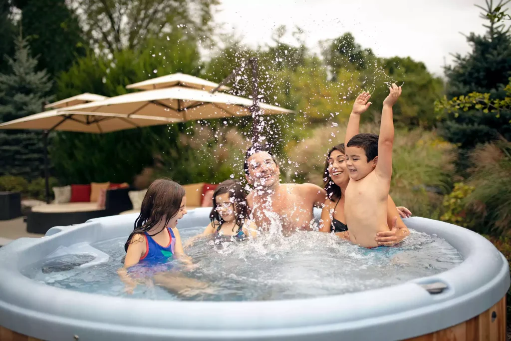 family relaxing in a hot tub
